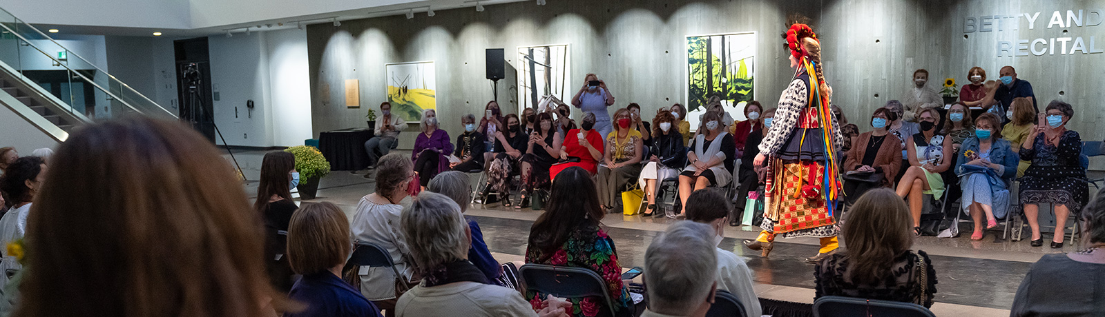 woman walking down runway at Threads That Connect event