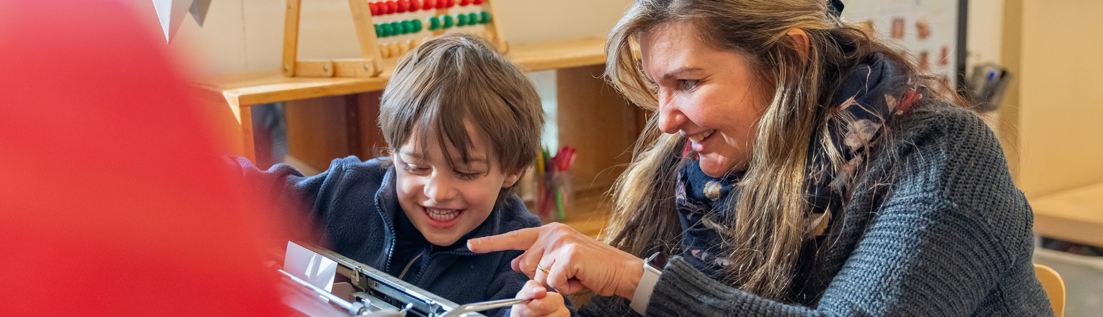 child playing with educator