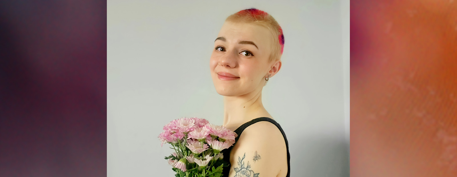 J. Heber holding flowers