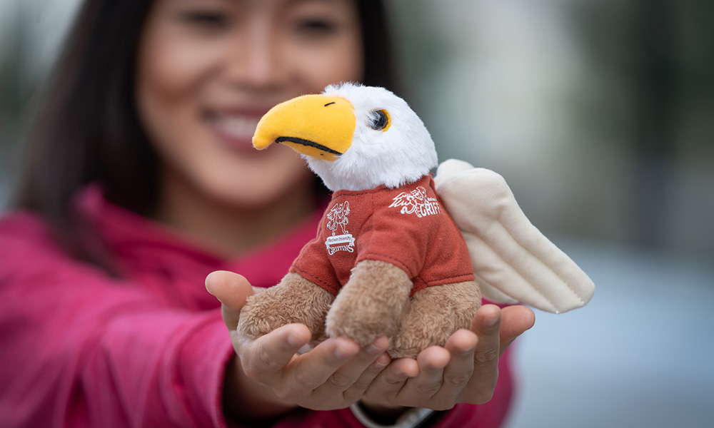 Student with Griffin stuffie