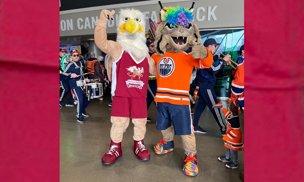 Two mascots stand in Rogers Place crowd