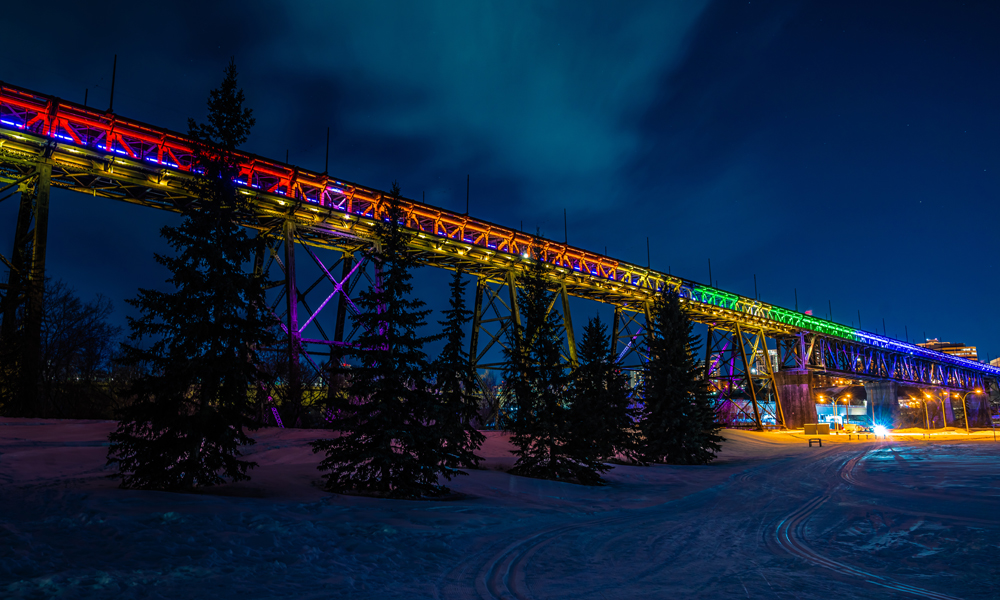 High Level Bridge lit up in rainbow lights at night