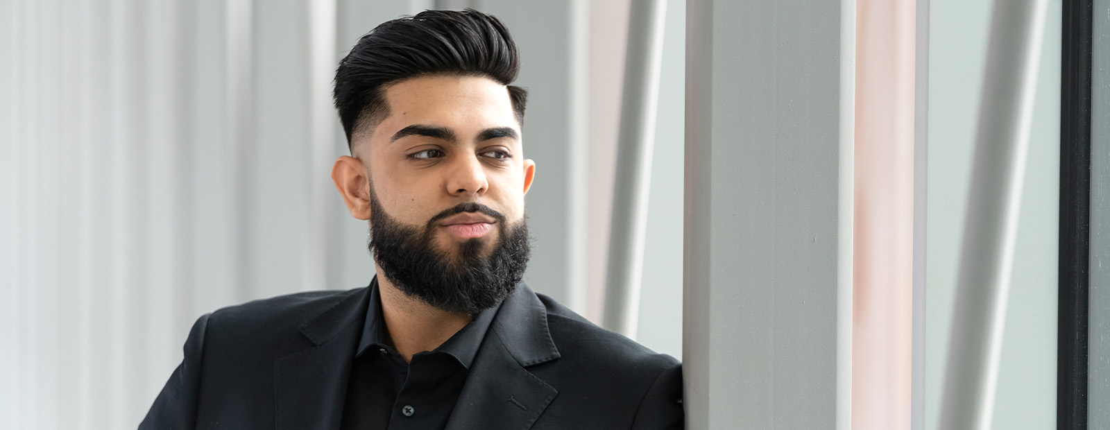 Abhijeet Singh looks out a window in Allard Hall