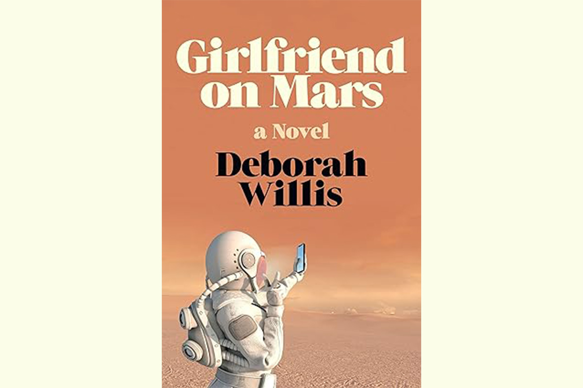 The book cover for Girlfriend on Mars, featuring an astronaut in a space suit looking at a cell phone screen.