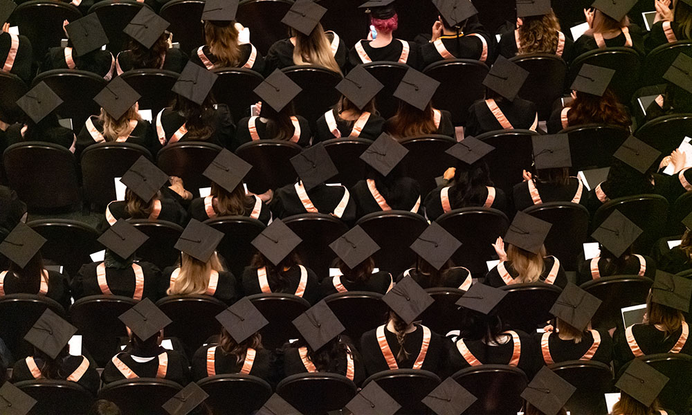 A top-down photof grads in their regalia