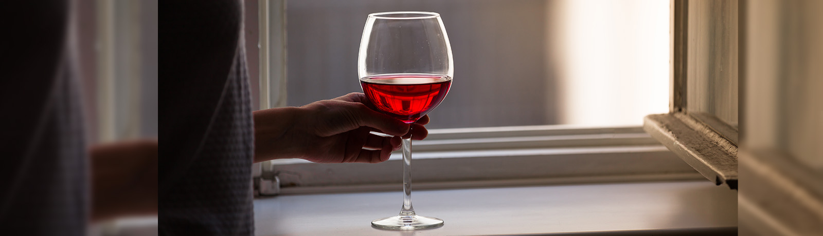 Image of woman holding a wineglass