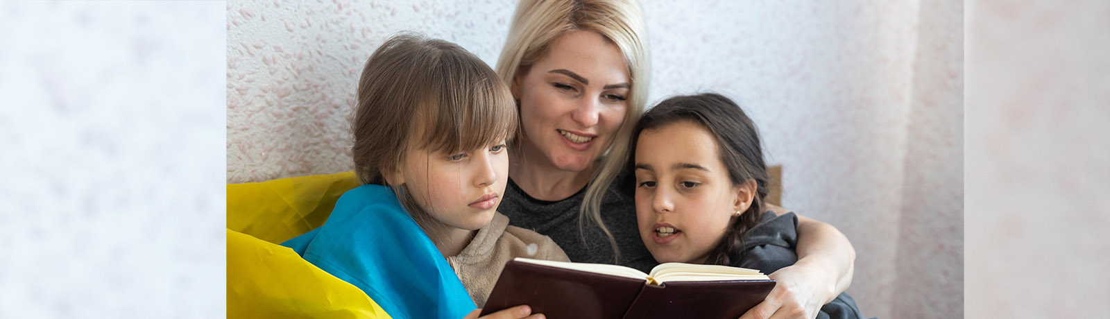 A mother reads two her two children