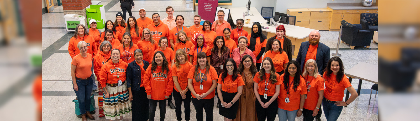 Faculty and staff gather wearing orange shirts in recognition of the National Day for Truth and Reconciliation in September 2023