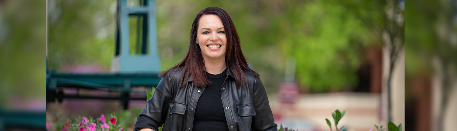 Ashley Stasiewich stands in front of Building 6 on MacEwan's campus