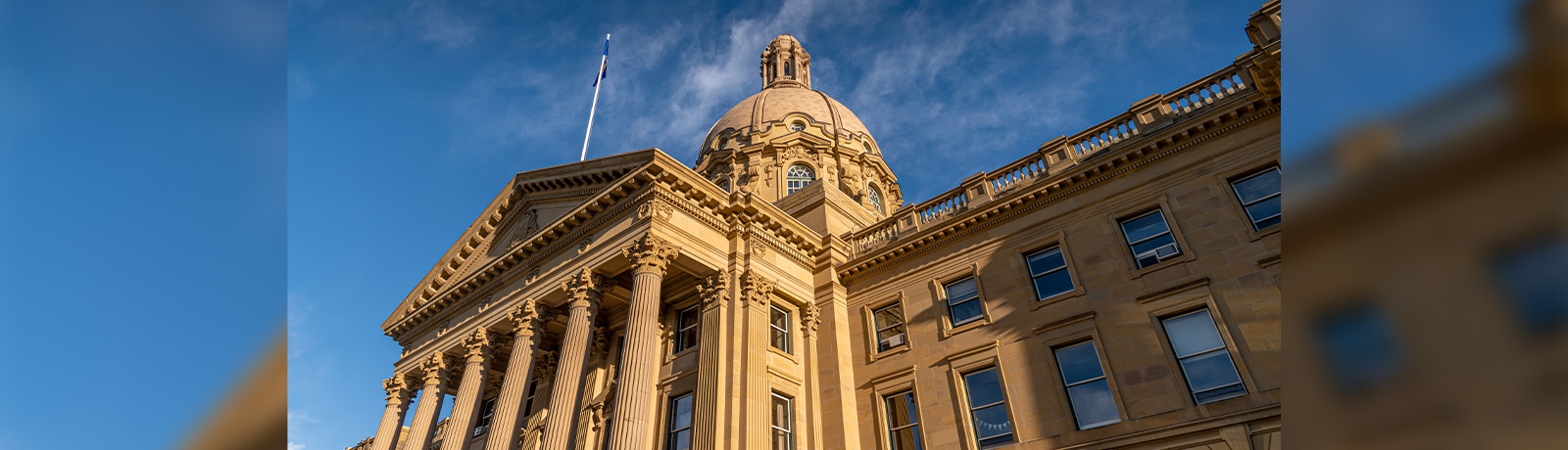 A low-angle photo of Alberta's legislature.