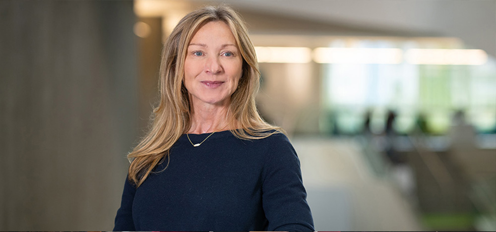 Dr. Leanne Hedberg stands in Allard Hall