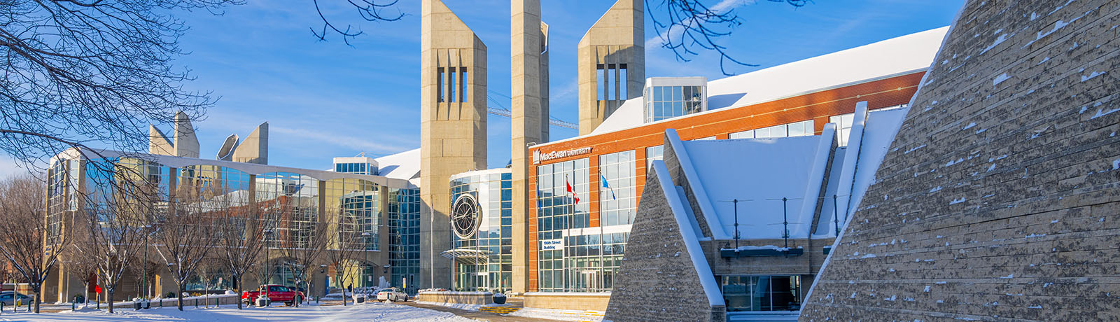 A winter image of MacEwan's main entrance with the clock tower