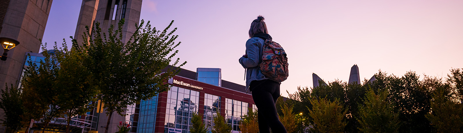 student walking outside macewan