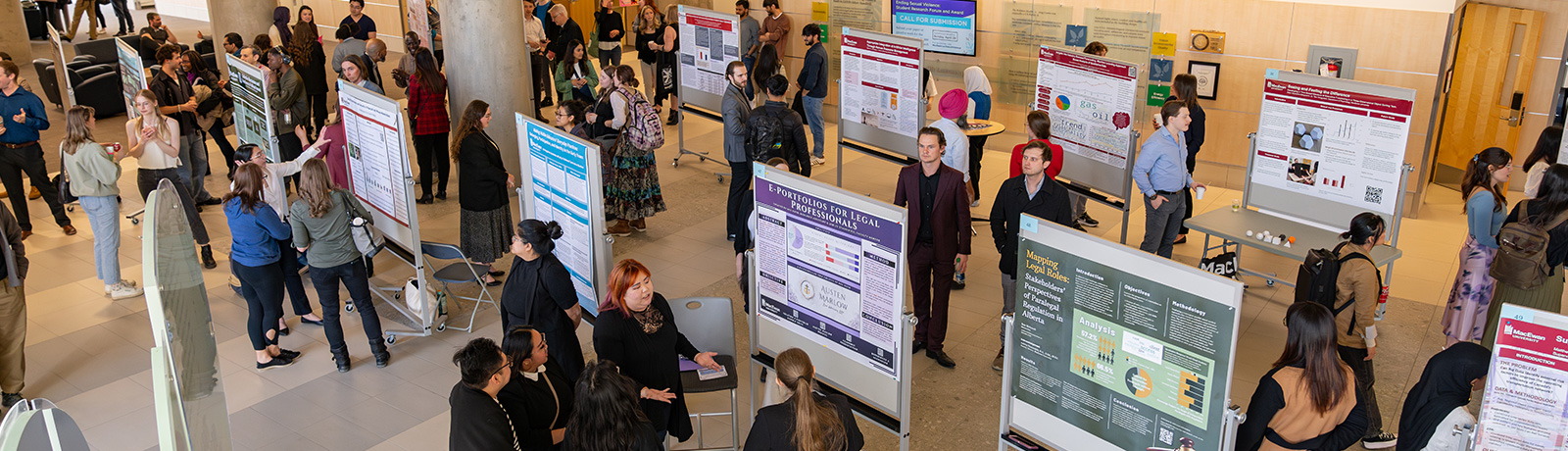student research day displays with crowd of people