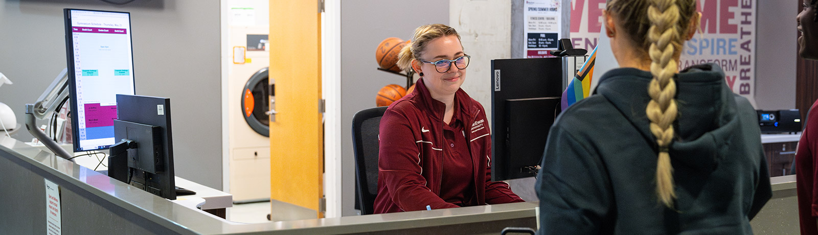 students at Sport and Wellness desk