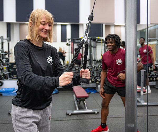 people working out on fitness machines