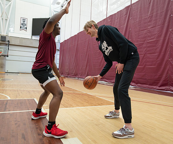 students playing basketball