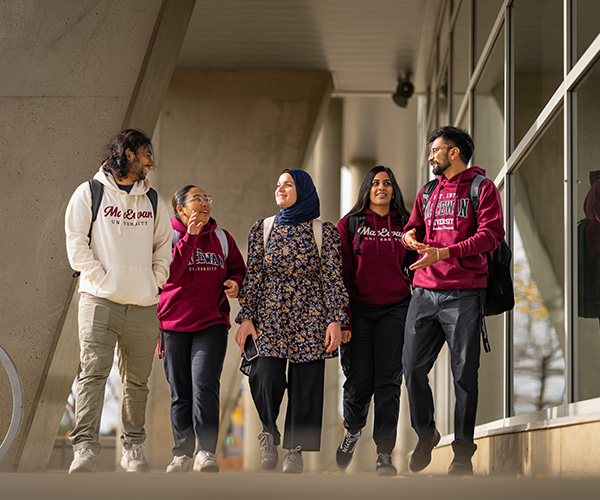 group of students outdoors walking and talking