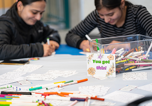 people colouring with markers