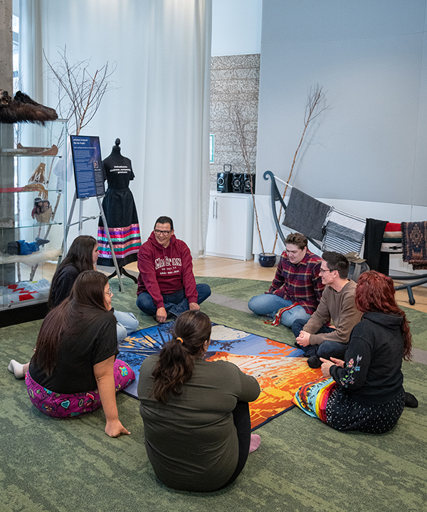 students sitting in group in kihew-waciston